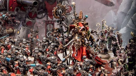 A Warhammer 40k Adeptus Mechanicus army, a huge group of Skitarii cyborg warriors, led by the centipede-like Belisarius Cawl, with a huge Imperial Knight in the background