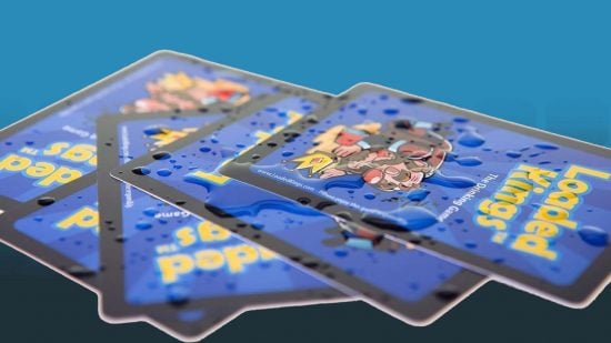 Best drinking card games - Loaded Kings cards with water spilled on them