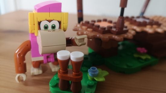 Lego Donkey Kong: Dixie Kong's Jungle Jam review image showing Dixie standing near a pair of drums.