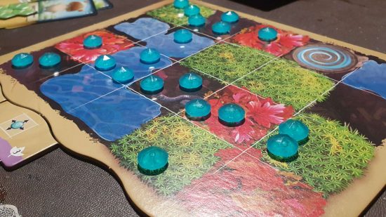 Mycelia review - a game board representing a forest floor covered with 'dewdrop' crystals