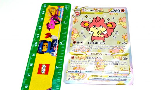Pokemon card size and weight guide - Wargamer photo showing a full art Simisear card with a Lego ruler measuring its length
