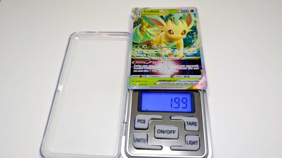 Pokemon card size and weight guide - Wargamer photo showing a Leafeon V-star card being weighed