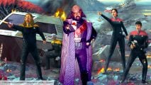 Star Trek RPG second edition reveal - Modiphius artwork showing Federation characters with phasers on an alien planet, overlaid with a Wikimedia Commons image of a Star Trek convention guest in Klingon costume