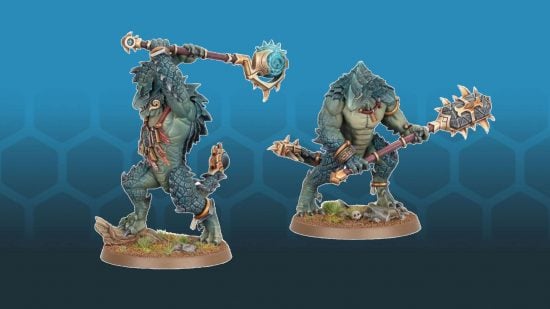 A pair of Warhammer the Old World Lizardmen Kroxigors, huge, muscular lizardmen wielding two-handed mauls