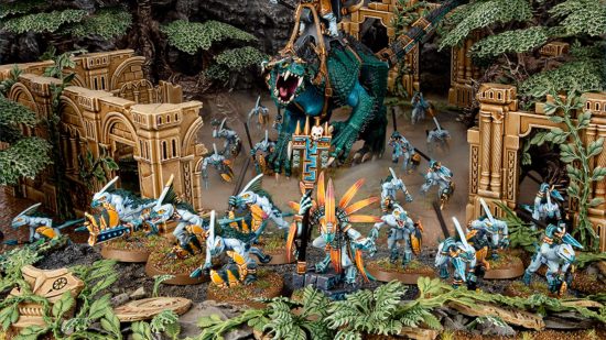 Warhammer the Old World Lizardmen - a screen of nimble and slender Skink lizardmen advance in front of a huge, tyrannosaur-like Carnosaur