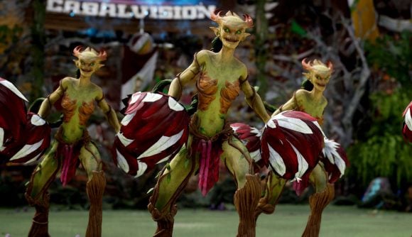 Blood Bowl3 Wood Elves - green Dryad cheerleaders holding red and white petal pom-poms