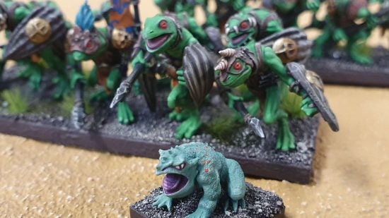 Kings of War green Riverguard frogmen, with a large frog in front of them