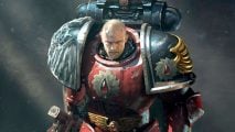 Gabriel Seth, Chapter Master of the Fleshtearers Space Marine chapter, a bald-headed man in battered red and black power armor, with the icon of a blood drop inside a circular saw on his pauldron