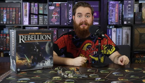 Star Wars Rebellion - board and savior Youtuber beside a copy of the game