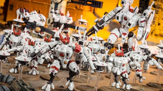 Tau Empire Codex units - an army of white T'au Crisis battlesuits, humanoid piloted robots with a variety of different weapons