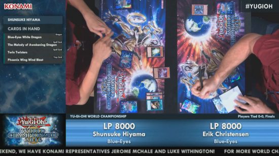 The YuGiOh World Championships final game in 2016 - shot of a game in progress, the arms of two players visible as they put cards on the table