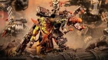 Warhammer 40k Orks codex - a Big Mek, an Ork wired into a suit of armor, wielding absurd weapons
