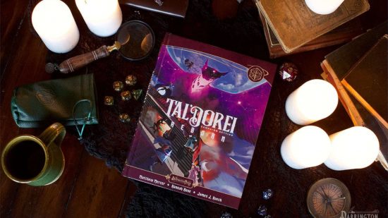 Critical Role Book Tal'dorei Reborn surrounded by dice and candles