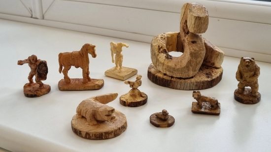Wooden DnD miniatures carved by Craig Griffiths