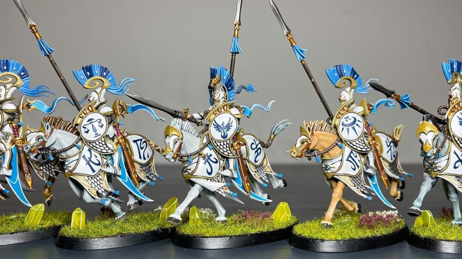 Painting miniatures guide layering shown via some lumineth elven riders in bright coloured armour