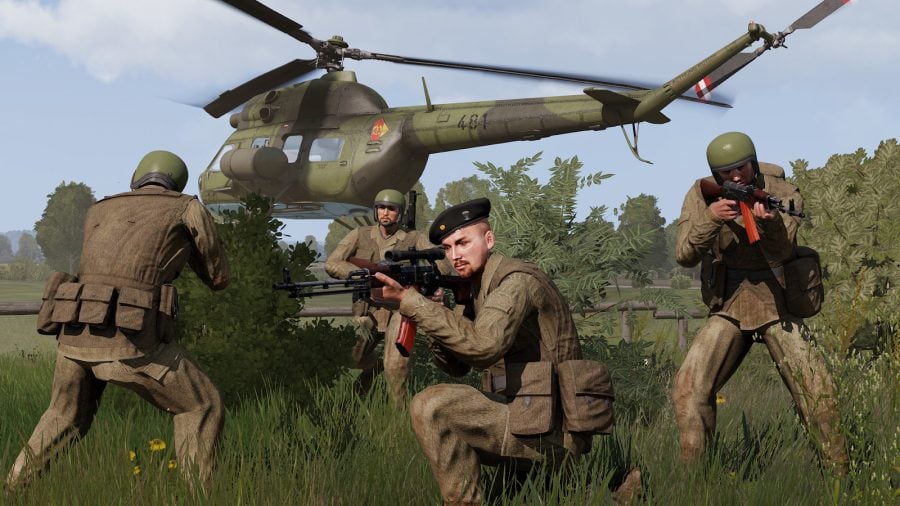 Soldiers from Arma 3 DCL Cold War Mobilization posing in front of a helicopter