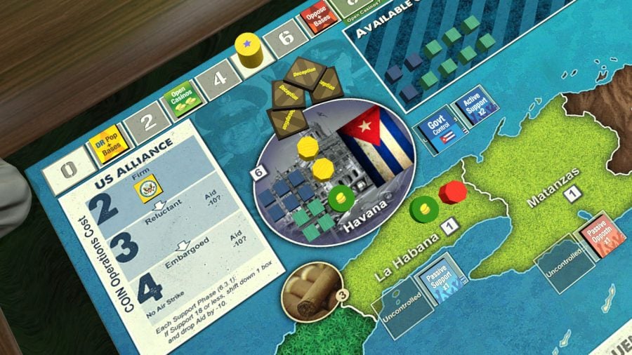 Tokens and cards lying on a Tabletop Simulator game of Cuba Libre