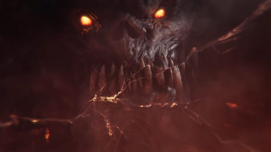 Total War Warhammer 3 trailer screenshot showing the angry face of Khorne, the Chaos God of Blood, Rage and Murder