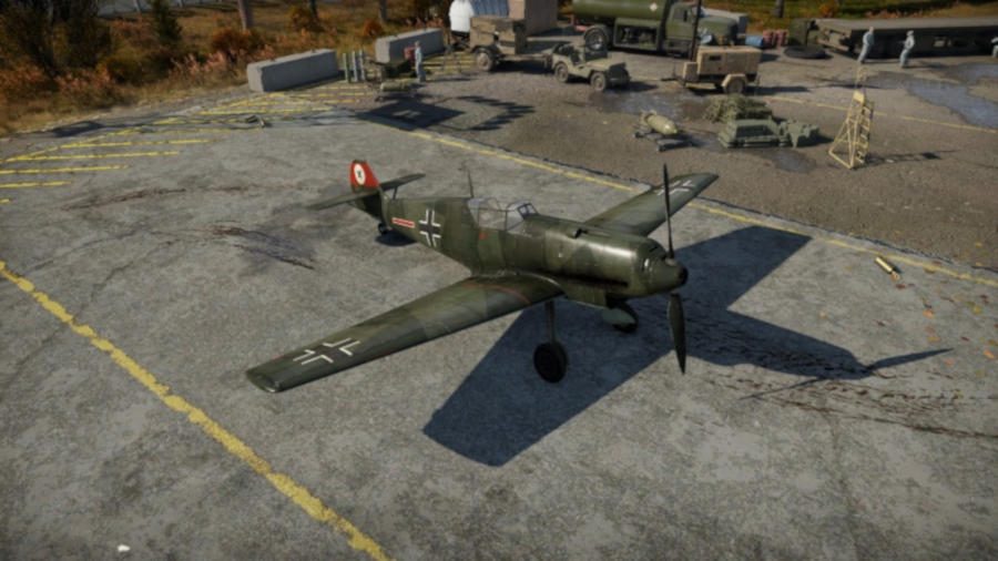 Small camouflaged War Thunder Plan sitting stationary on concrete