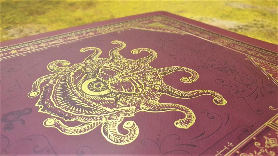 Photo showing the back cover of Candlekeep Mysteries Collectors Edition, with an etched gold Beholder