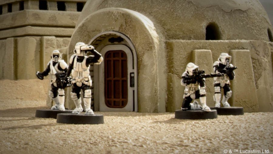 Imperial Scout Troopers from a Star Wars: Legion expansion pack positioned next to a building on Tatooine