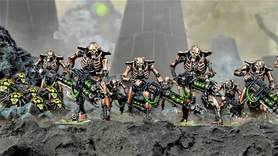 Photo showing Games Workshop Necron Warriors models painted, advancing across a 40K battlefield