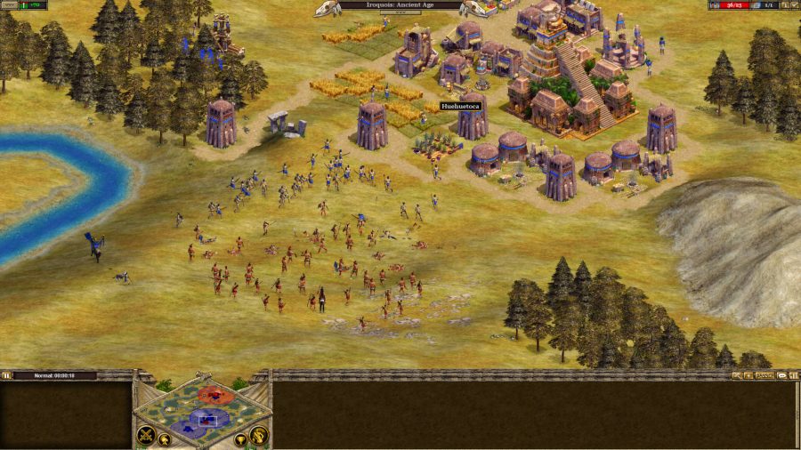 Infantry in Rise of Nations skirmishing next to an ancient city in one of the best games like Age of Empires, Rise of Nations