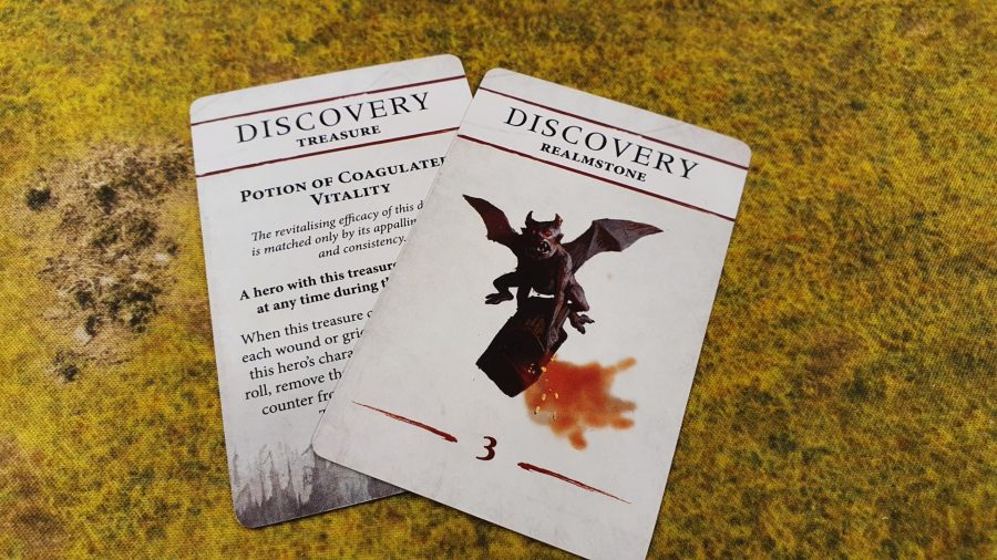 Photo of two discovery cards from Warhammer Quest Cursed City