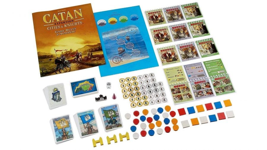 Rulebook, cards, and tokens used in Catan: Cities and Knights spread out