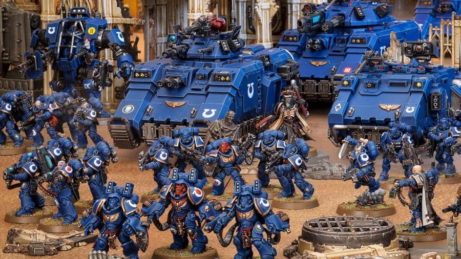 Warhammer 40k Ultramarines guide - Warhammer Community photo showing a Primaris Ultramarines force, including Aggressors and Impulsor tanks