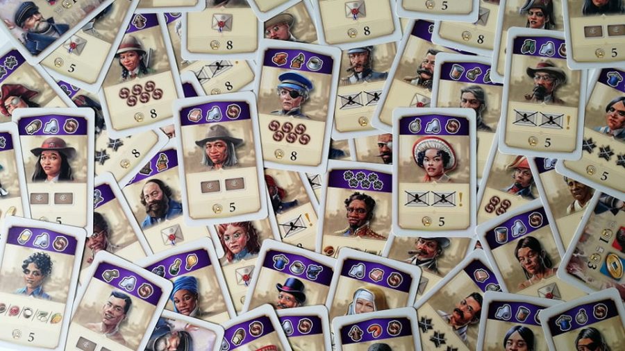 Anno 1800 board game character cards laid on top of each other