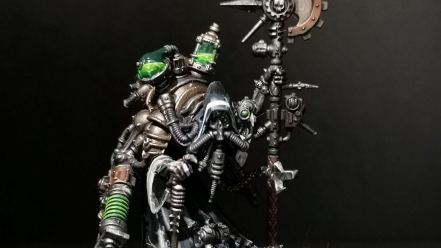 Warhammer 40k Adeptus Mechanicus 9th edition guide photo showing a painted Tech Priest Dominus model