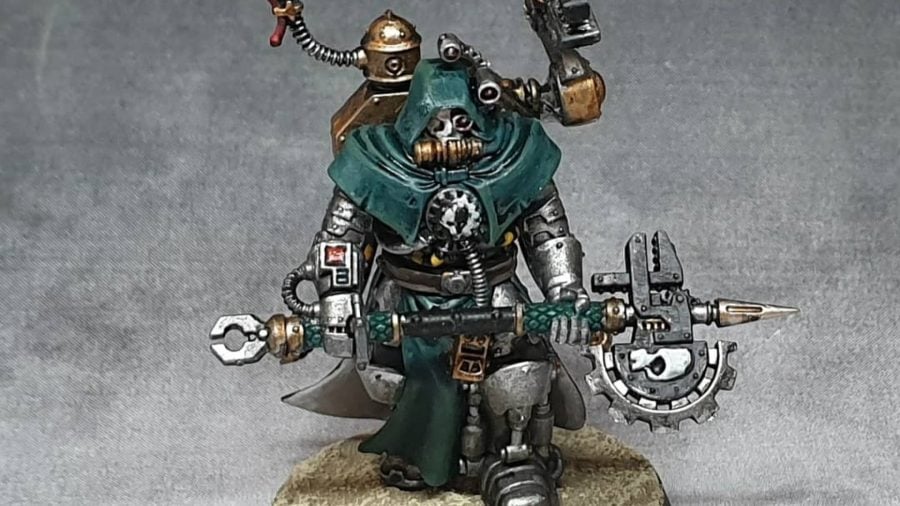 Warhammer 40k Adeptus Mechanicus 9th edition guide photo showing a painted tech priest enginseer model