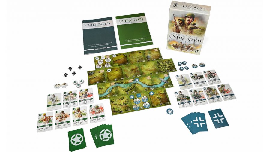 Undaunted: Normandy box, cards, tiles, and rulebooks laid out