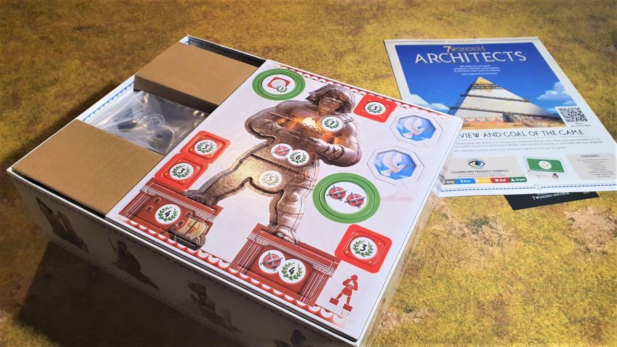 7 Wonders: Architects Review - author photo showing the open box while unboxing, and an untouched punchboard for the Colossus of Rhodes Wonder