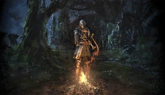 Dark Souls tabletop RPG release date - Bandai Namco cover art from Dark Souls Remastered showing a bonfire and hero in plate armour