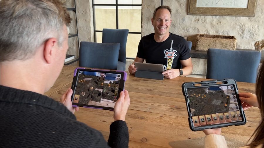 D&D Mirrorscape Augmented Reality platform and accessibility for players - Author photo showing several people playing using the AR platform on tablets