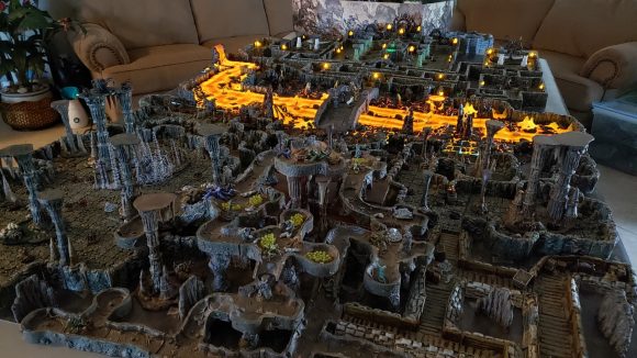 DnD setups Florida man - Todd's photo showing himself with a tabletop setup featuring a huge dungeon and lava river
