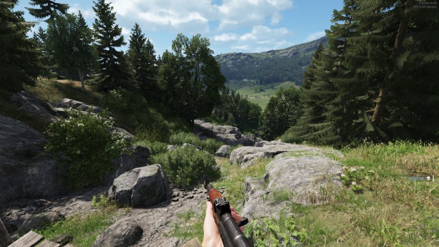 Arma 4 reforger hands on: First person view a person holding a gun walking down a forested hill