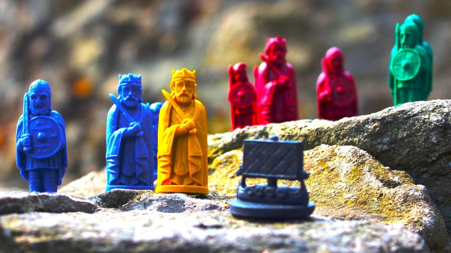 Bretwalda review - meeples of Anglo-Saxon kings, soldiers, and boats placed on a rock