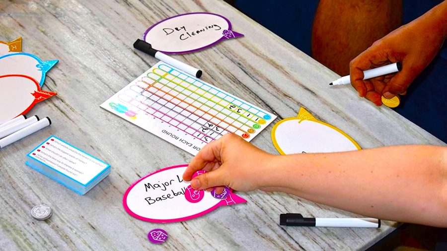 Funny board games - A game of Say Anything with whiteboards, pens, and counters on a table