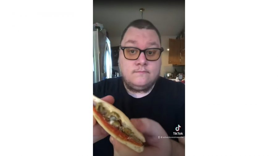 DnD roll for sandwich - a man eating a big sandwich.